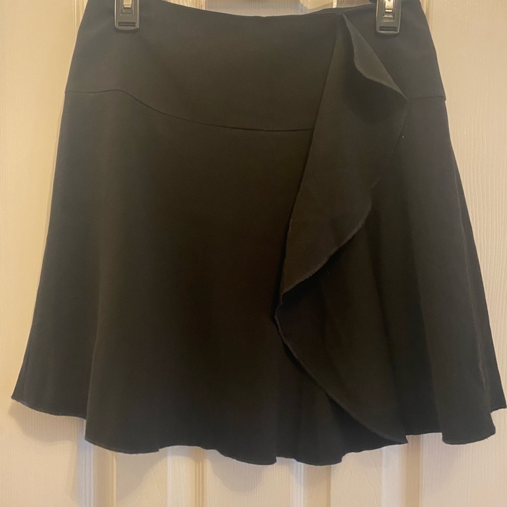 NWT Black LOFT skirt with ruffle detail. Perfect length for office or going out.
